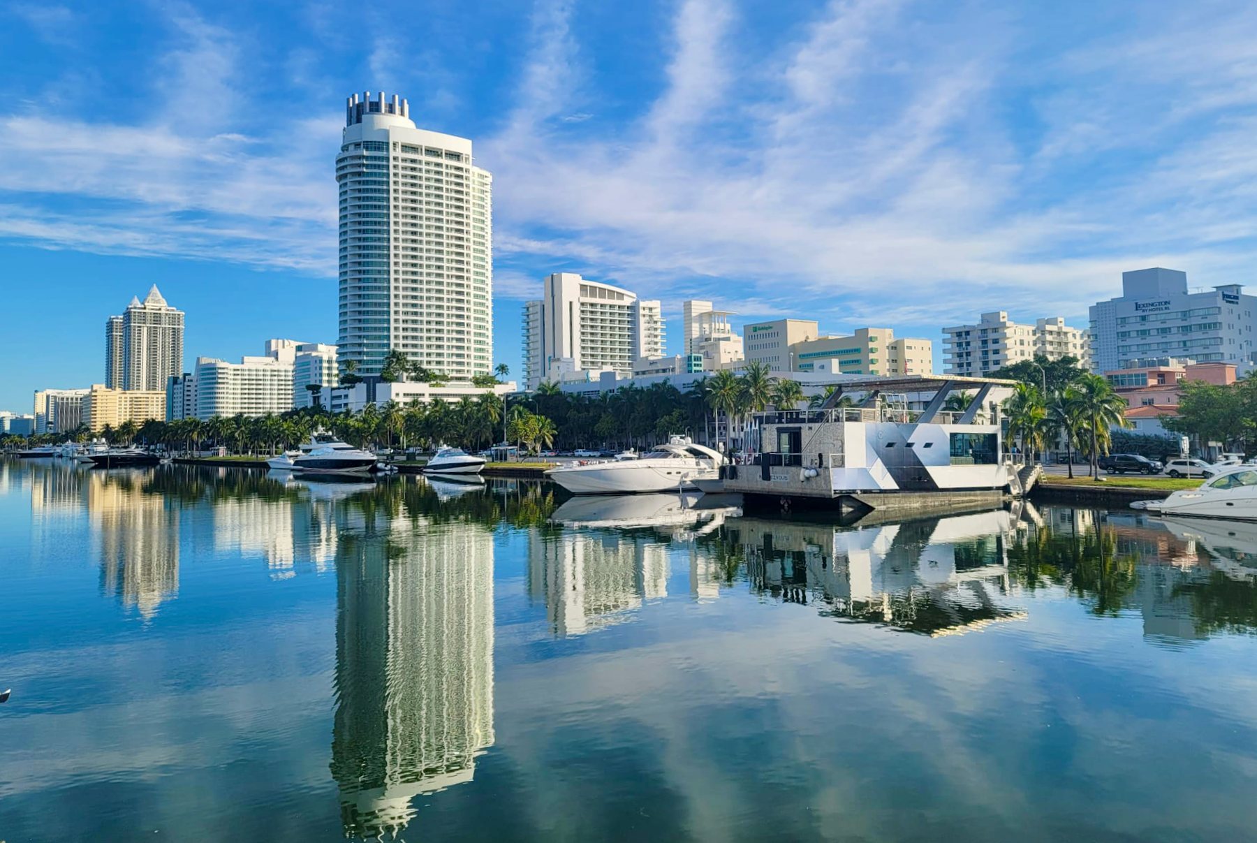 Indian Creek in Mid-Beach with yachts and towers reflected in the water near the Fontainebleau, Miami Beach