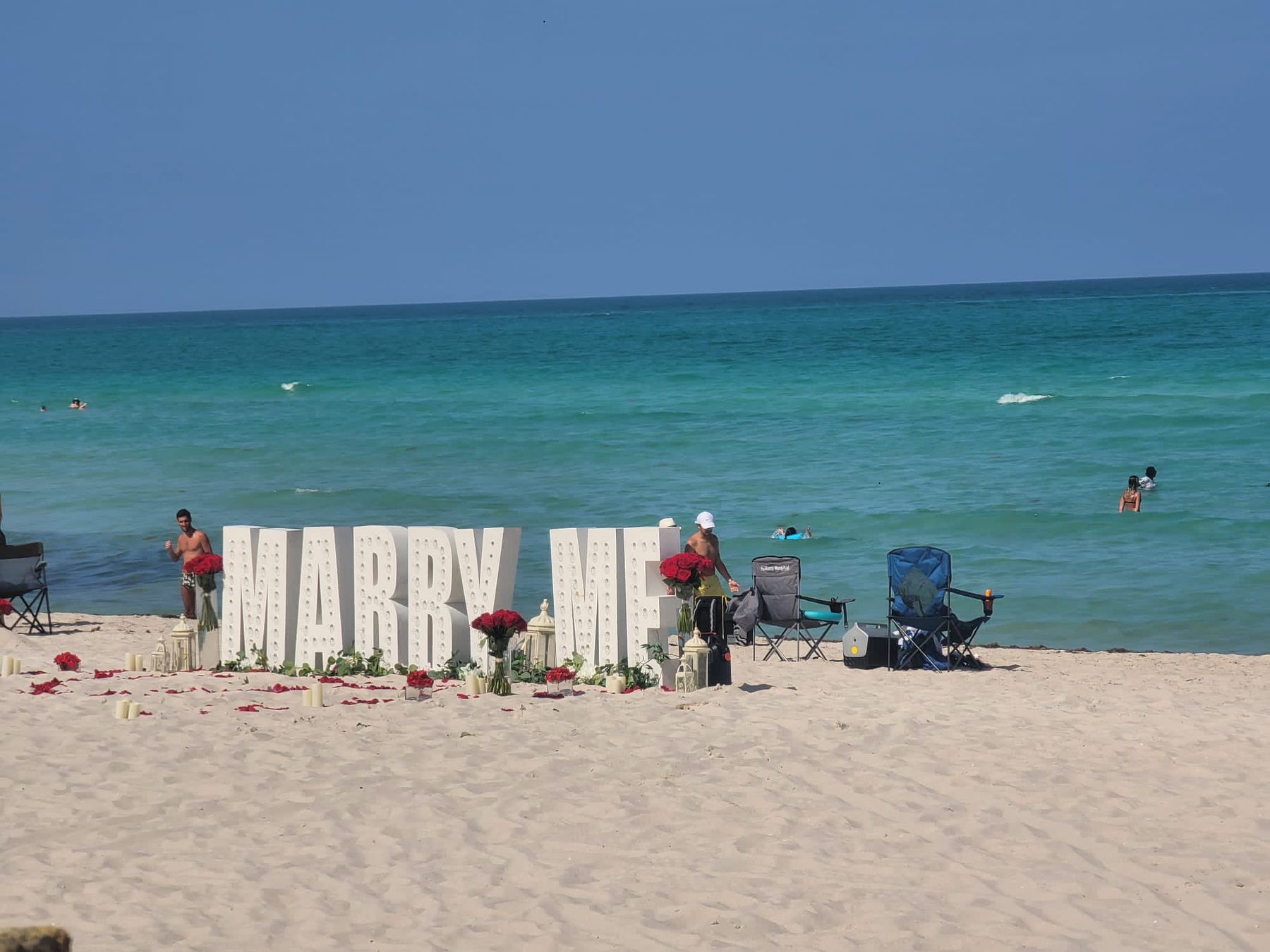 Marriage proposal with Marry Me letters on the beach in Miami Beach