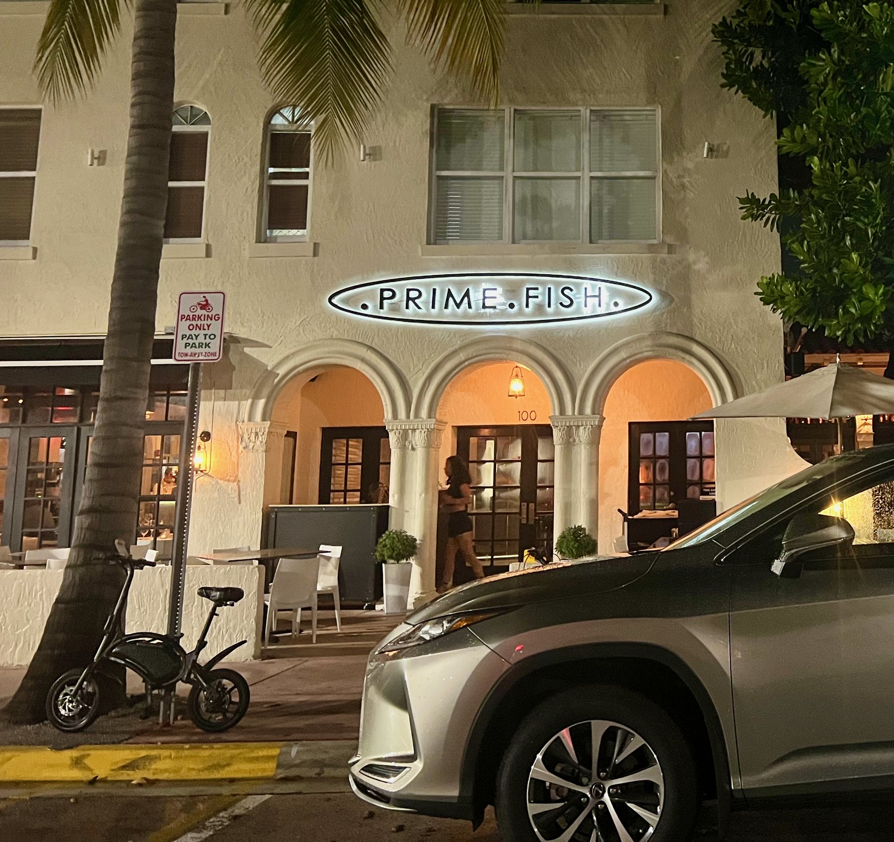 Arched restaurant facade at Collins Avenue and 1st Street, South of Fifth, Miami Beach at night