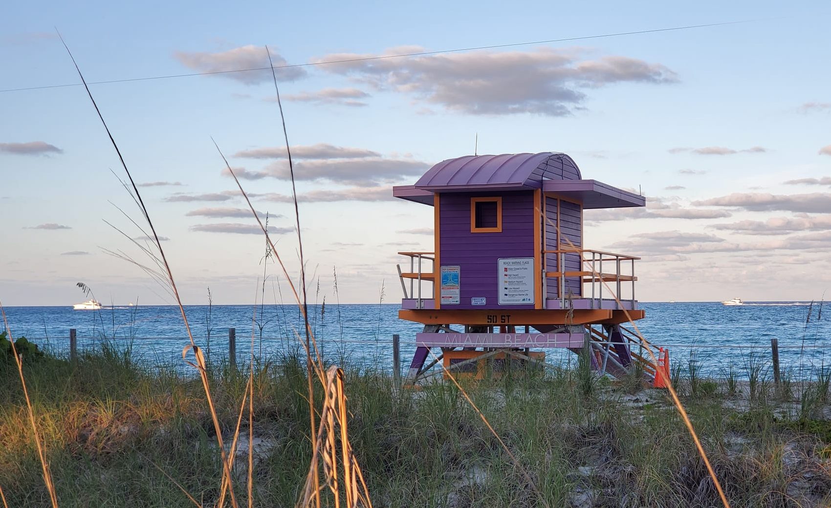 Purple 50th Street lifeguard tower in Miami Beach at sunset